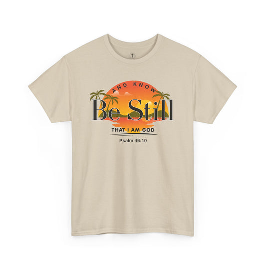 Christ Centered Faith men's Christian T-shirt with "Be Still And Know That I Am God" and Psalm 46:10 Bible verse text in black over retro multicolor island, sun and palm tree design on beige background.