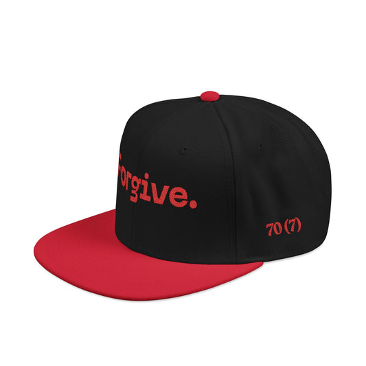 Christ Centered Faith unisex Christian flat brim snapback hat with "Forgive" and "70 (7)" text embroidered in red with red brim on black background, side view.
