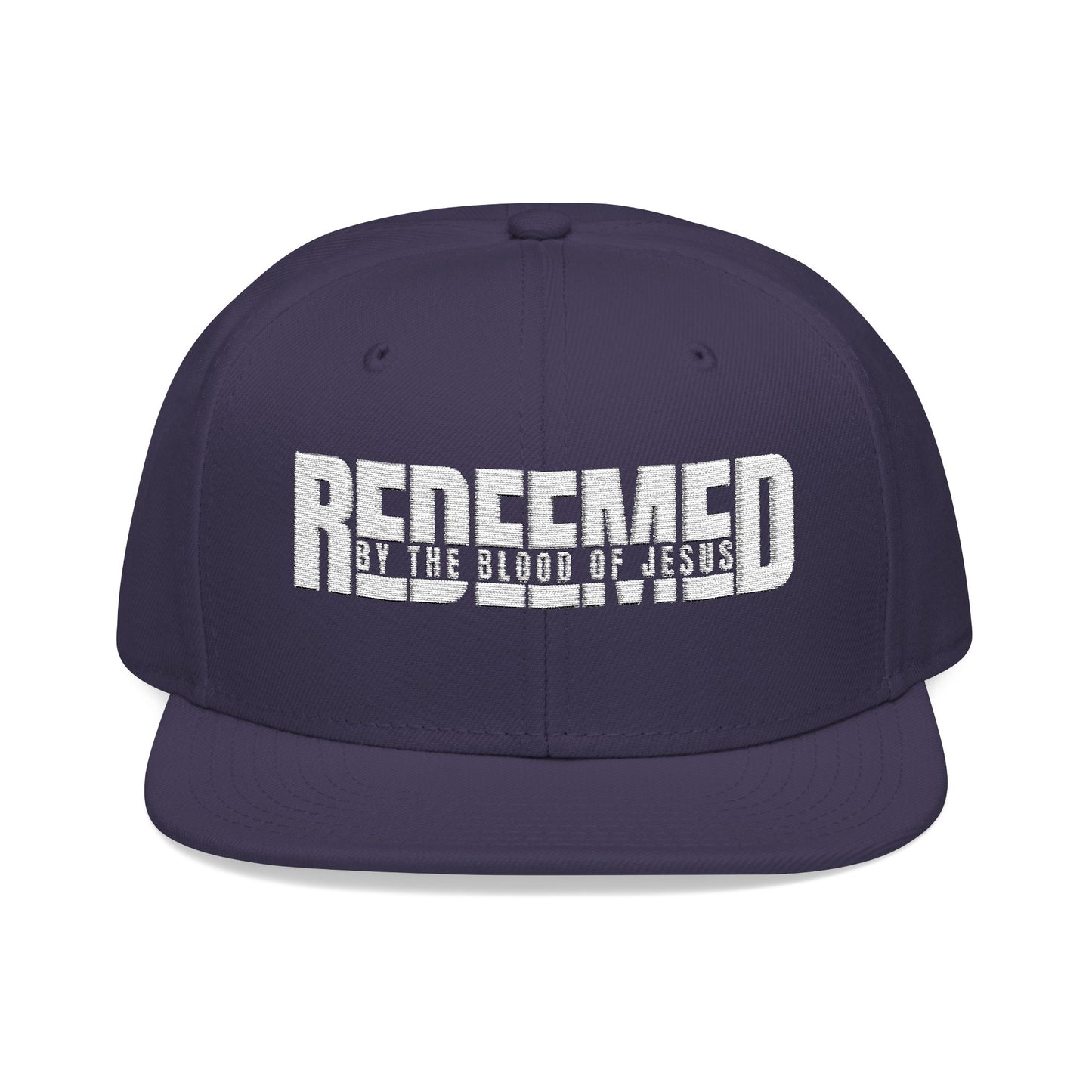 Christ Centered Faith unisex Christian snapback hat with "Redeemed By The Blood Of Jesus" text embroidered in white on navy background.