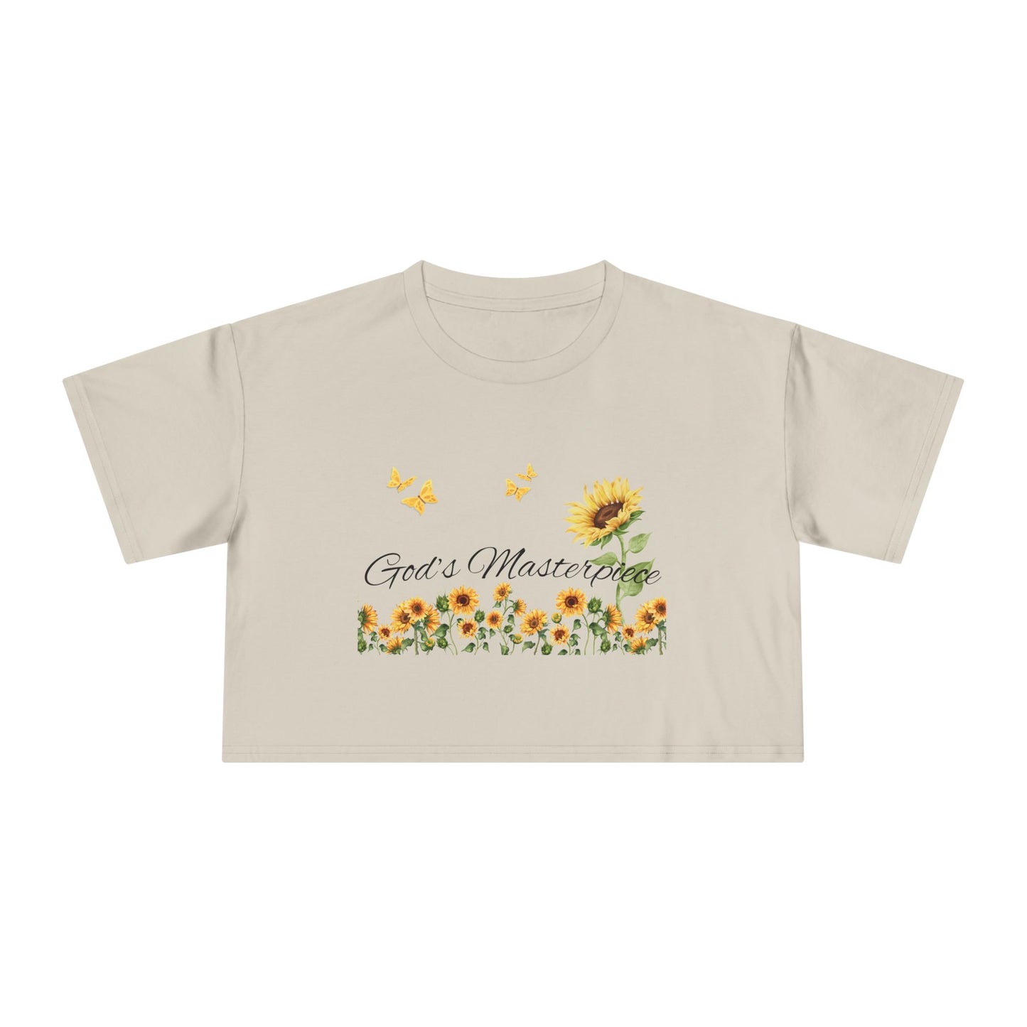 Christ Centered Faith women's cropped Christian t-shirt with "God's Masterpiece" text in black surrounded by sunflowers and yellow butterflies on beige background.