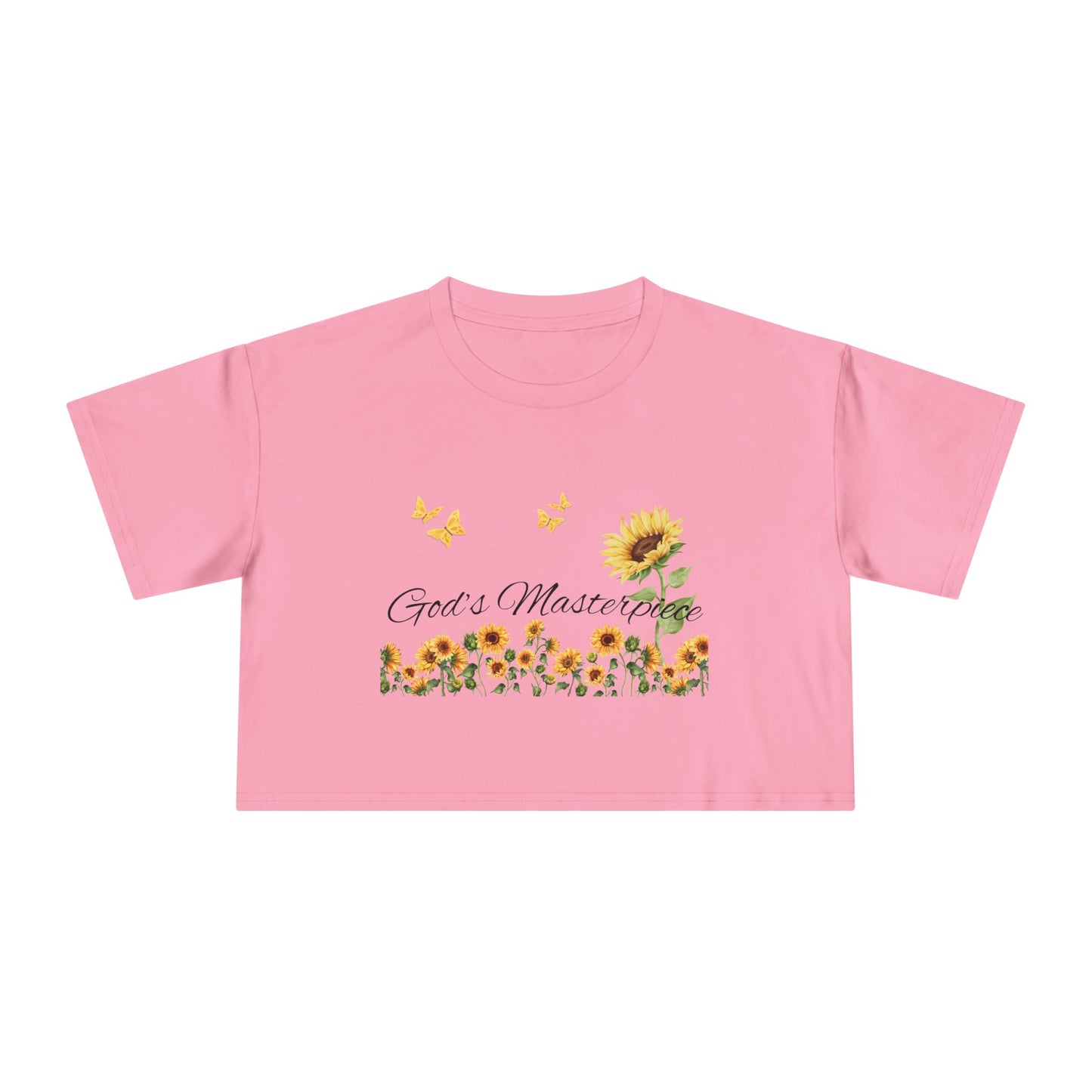 Christ Centered Faith women's cropped Christian t-shirt with "God's Masterpiece" text in black surrounded by sunflowers and yellow butterflies on pink background.