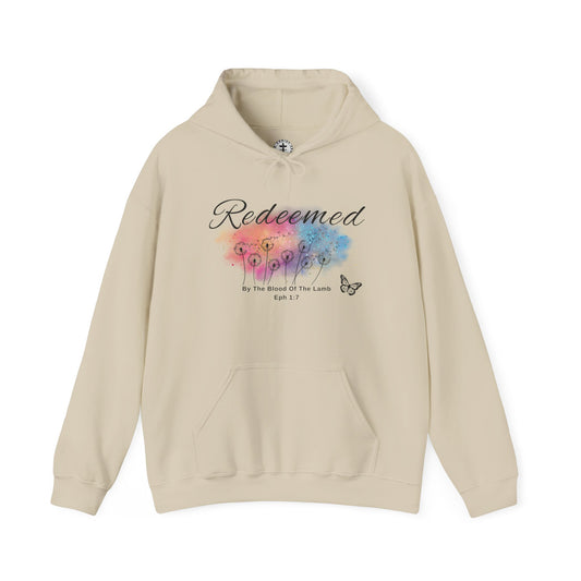 Christ Centered Faith women's Christian hoodie with "Redeemed By The Blood Of The Lamb" and Ephesians 1:7 Bible verse text in black over a multicolor watercolor mark with black butterfly and dandelions on beige background.