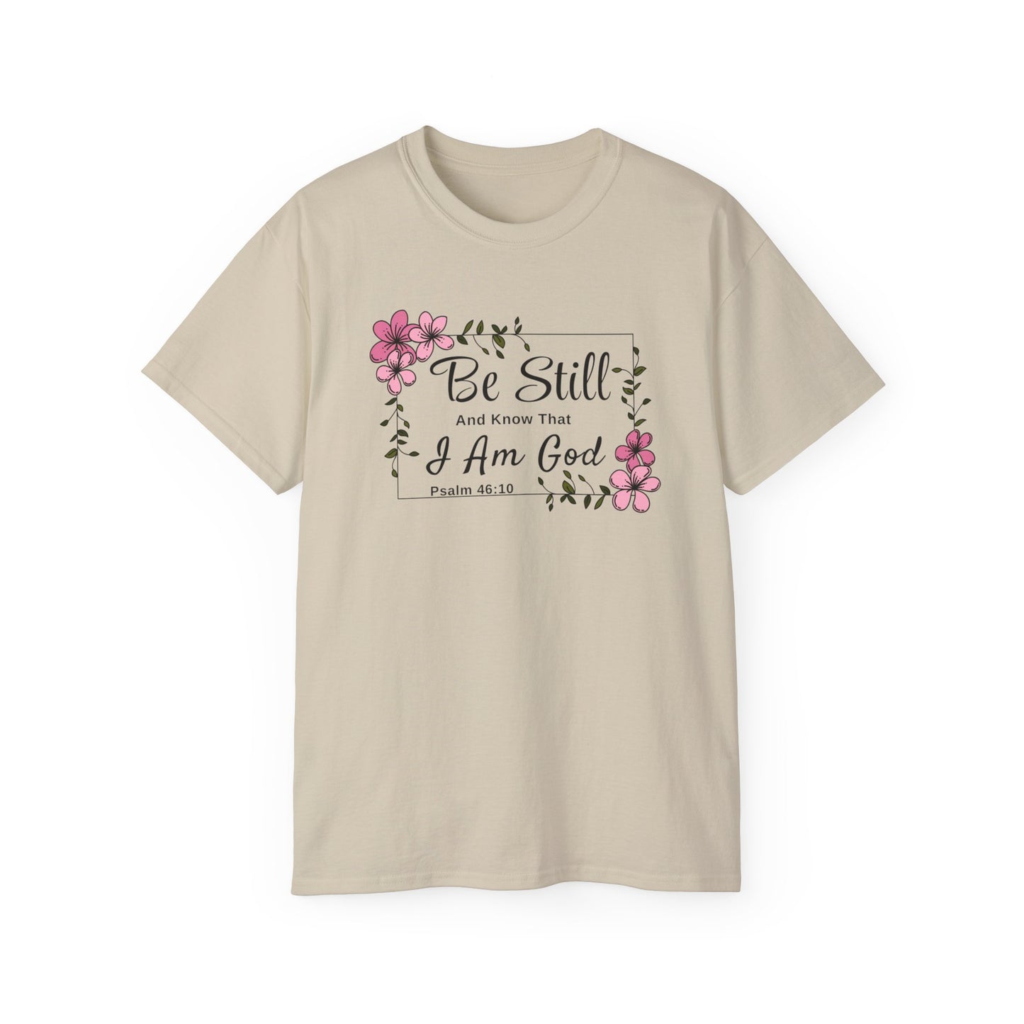 Christ Centered Faith women's Christian t-shirt with "Be Still And Know That I Am God" and Psalm 46:10 Bible Verse text in black with pink flowers and green vine on beige background.
