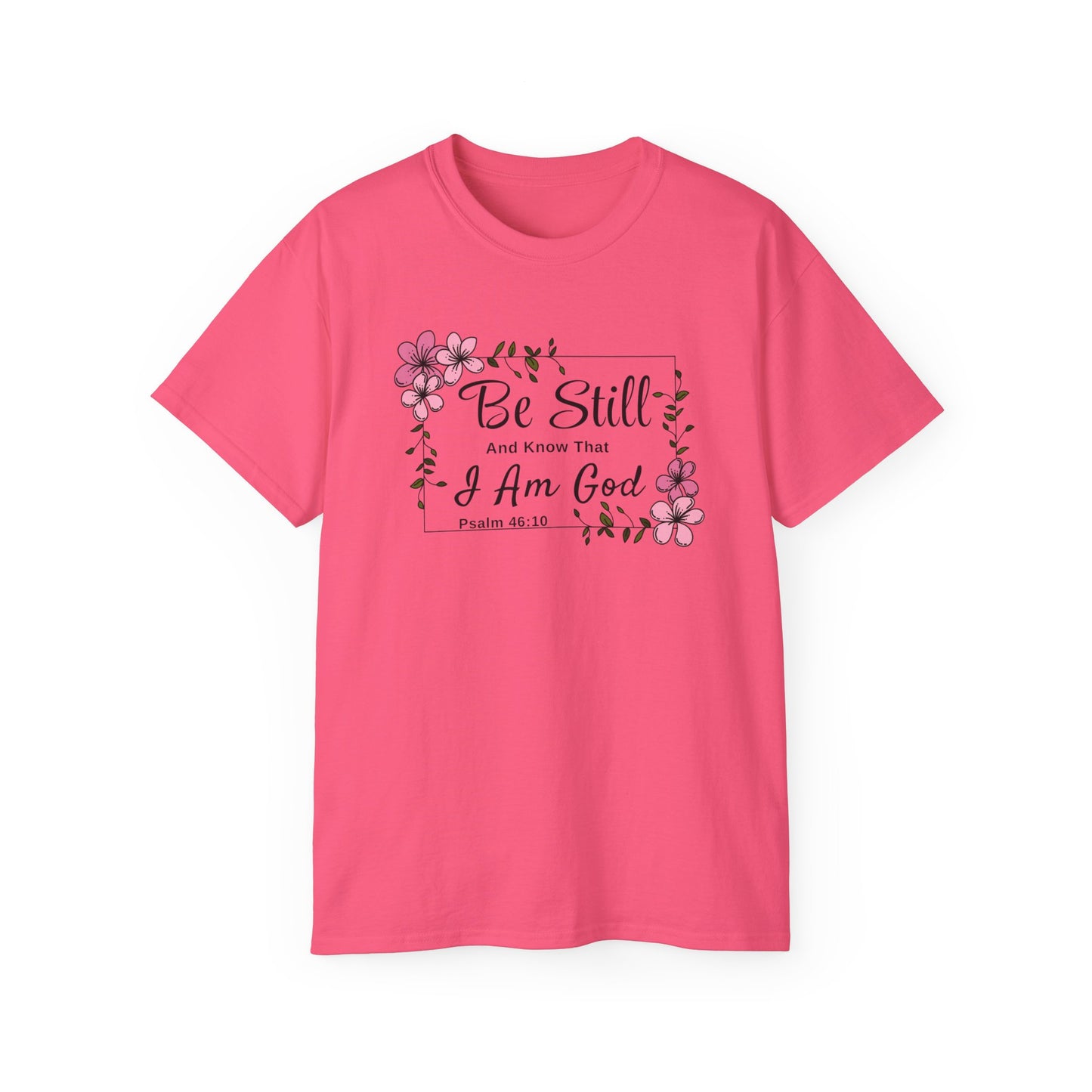 Christ Centered Faith women's Christian t-shirt with "Be Still And Know That I Am God" and Psalm 46:10 Bible Verse text in black with pink flowers and green vine on pink background.