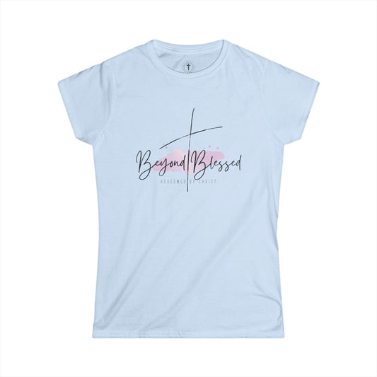 Christ Centered Faith women's Christian T-shirt with "Beyond Blessed" and "Redeemed By Christ" text in black and thin black cross design over watercolor pastel mark on blue background.