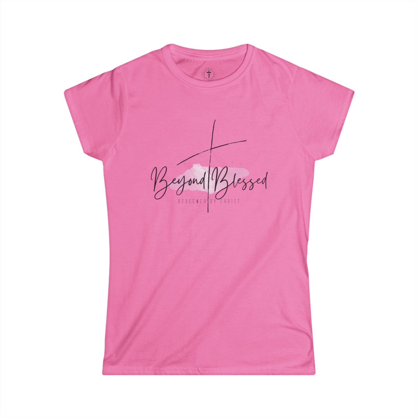 Christ Centered Faith women's Christian T-shirt with "Beyond Blessed" and "Redeemed By Christ" text in black and thin black cross design over watercolor pastel mark on pink background.